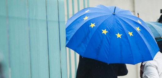 A man enters the chancellery in Berlin before talks between government and opposition leaders about the EU fiscal pact
